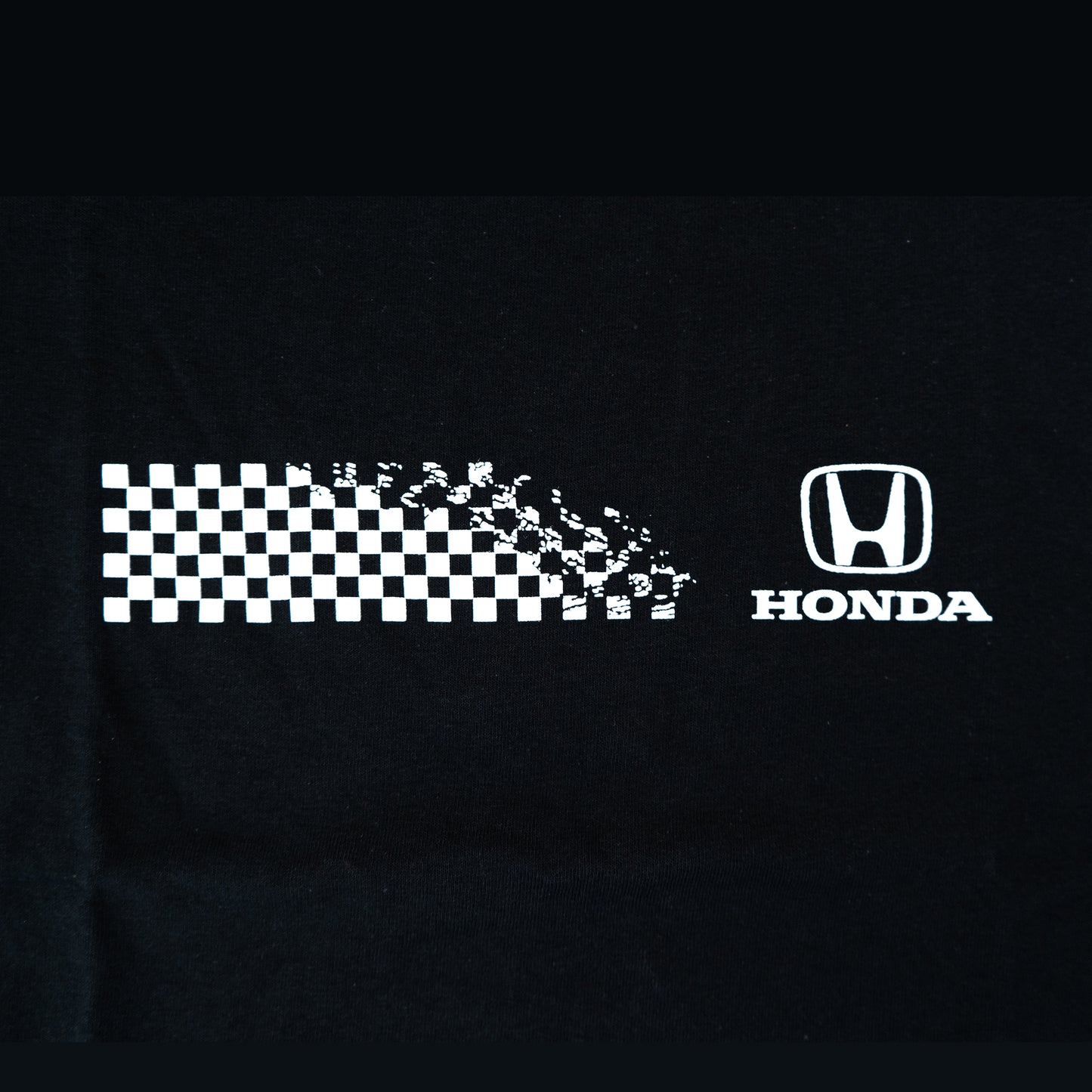 Black shirt with white checkered pattern and Honda logo