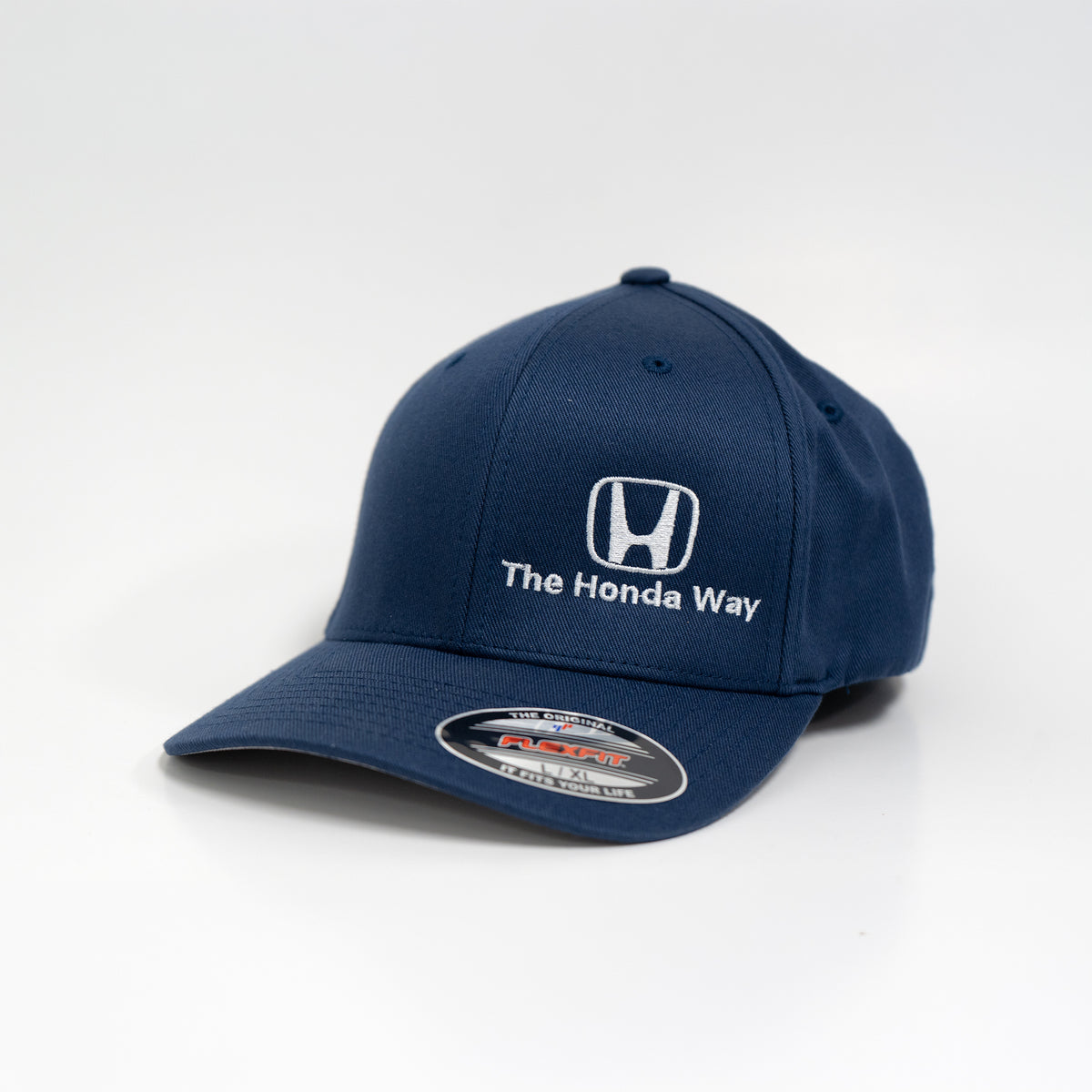 Navy blue cap with Honda logo and 'The Honda Way' text on a white background