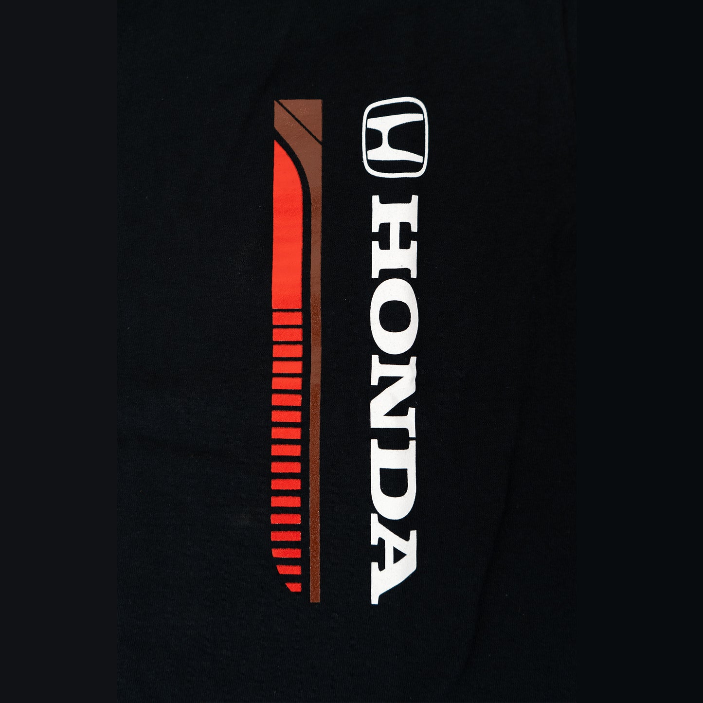 Black t-shirt with Honda logo and design on a black background