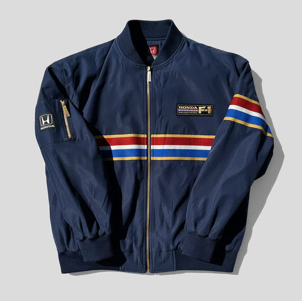 Navy blue jacket with colorful stripes and Honda logo on a light gray background