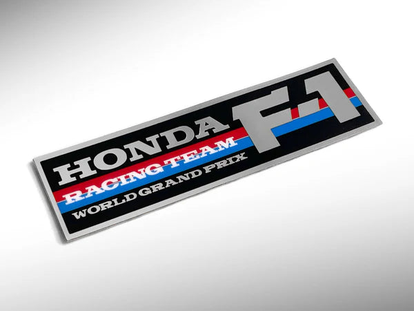 Honda Racing Team World Grand Prix logo on a reflective surface