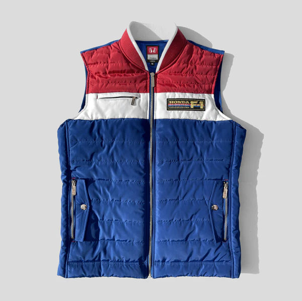 Blue and red puffer vest with Honda logo on a light gray background