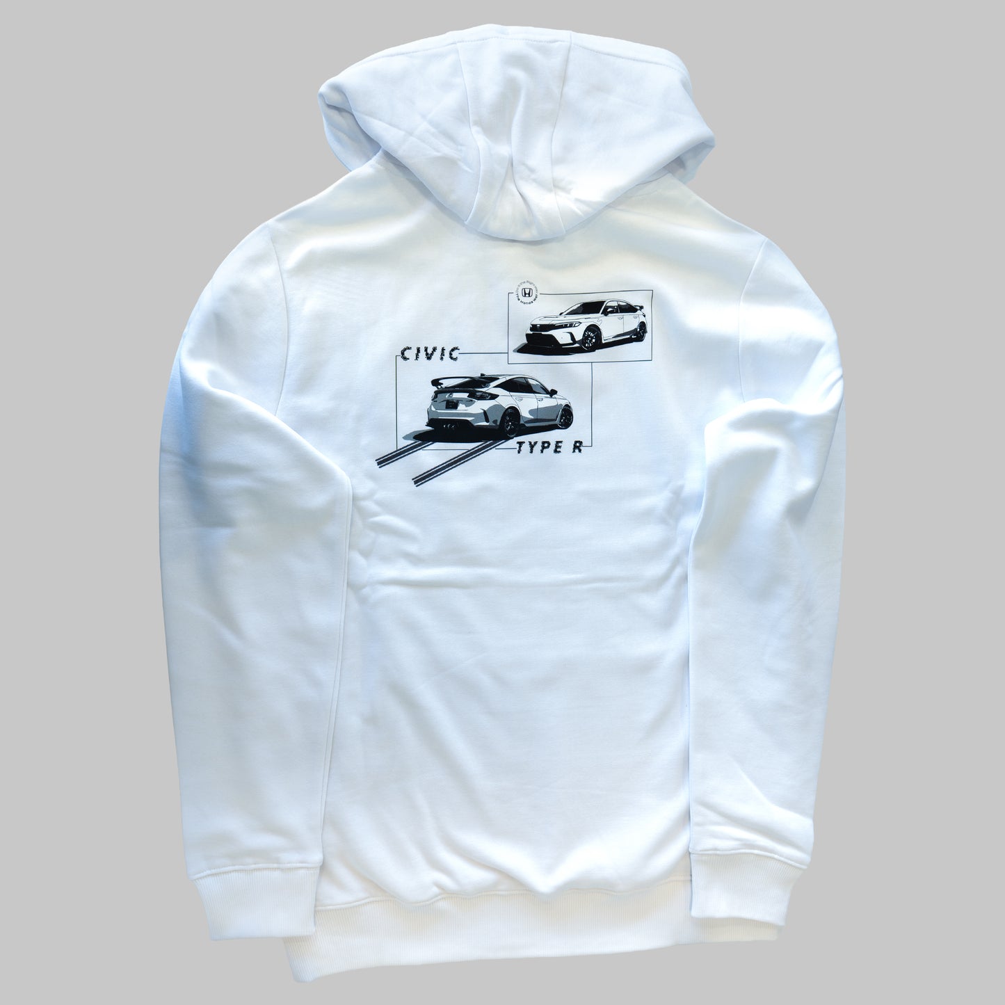 White hoodie with car graphic on the back against a gray background