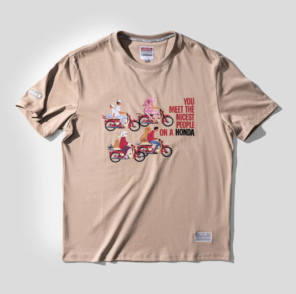 Beige t-shirt with graphic design and text on a light gray background