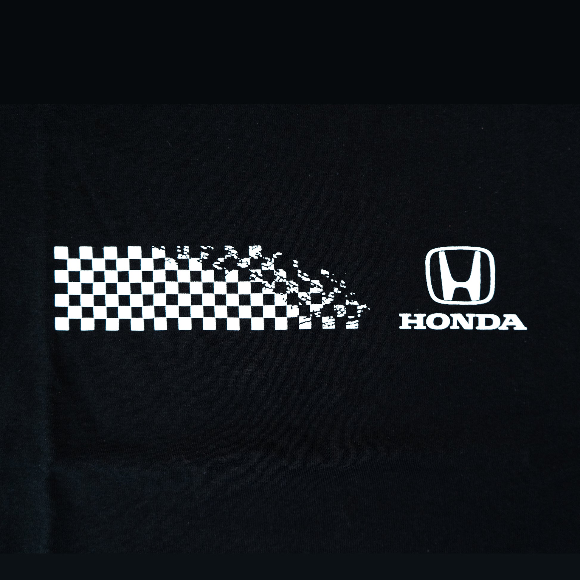 Black shirt with white checkered pattern and Honda logo