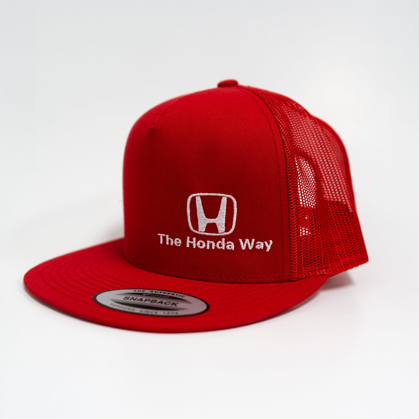 Red cap with Honda logo and 'The Honda Way' text on a white background