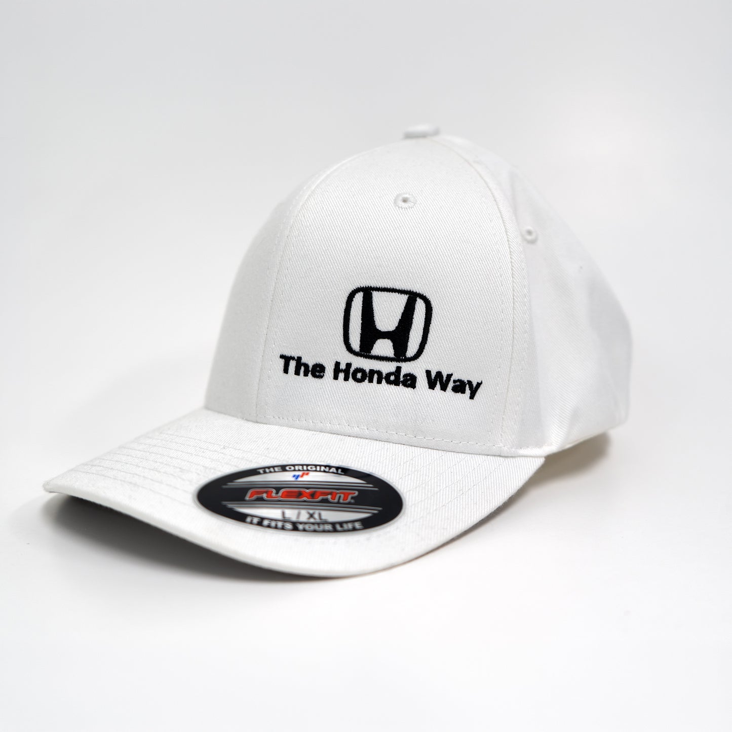 White cap with Honda logo and 'The Honda Way' text on a white background
