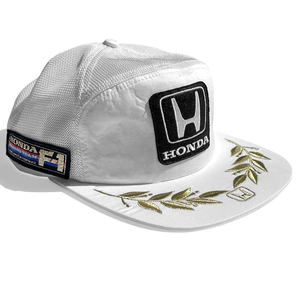 White cap with Honda logo and racing details on a white background