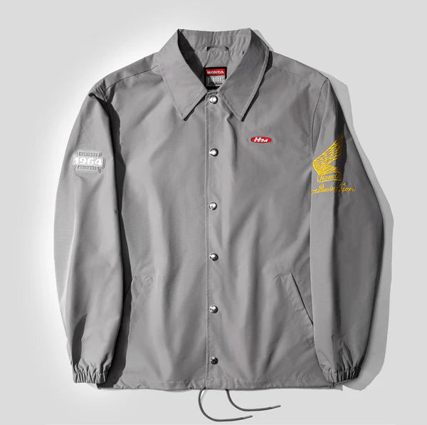 Gray jacket with brand logos on a light gray background