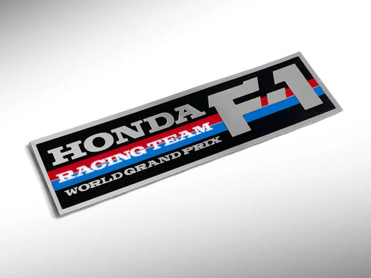 Honda Racing Team World Grand Prix logo on a reflective surface